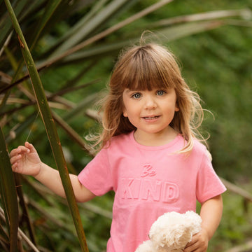 Toddler girl wearing Be kind organic cotton tee shirt