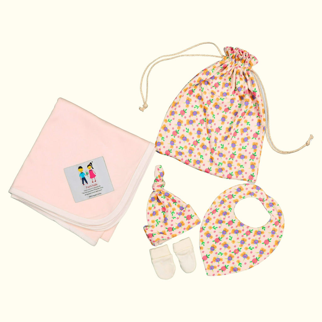 organic cotton baby gift bag with blanket, beanie, mittens and bib.