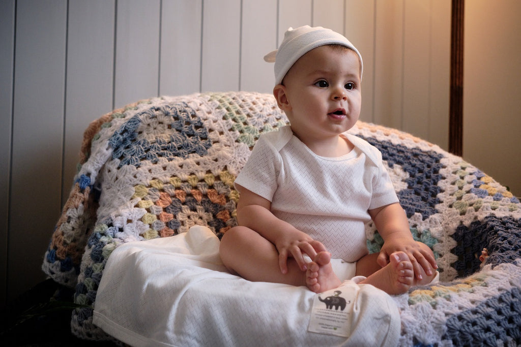 baby wearing natural organic cotton beanie