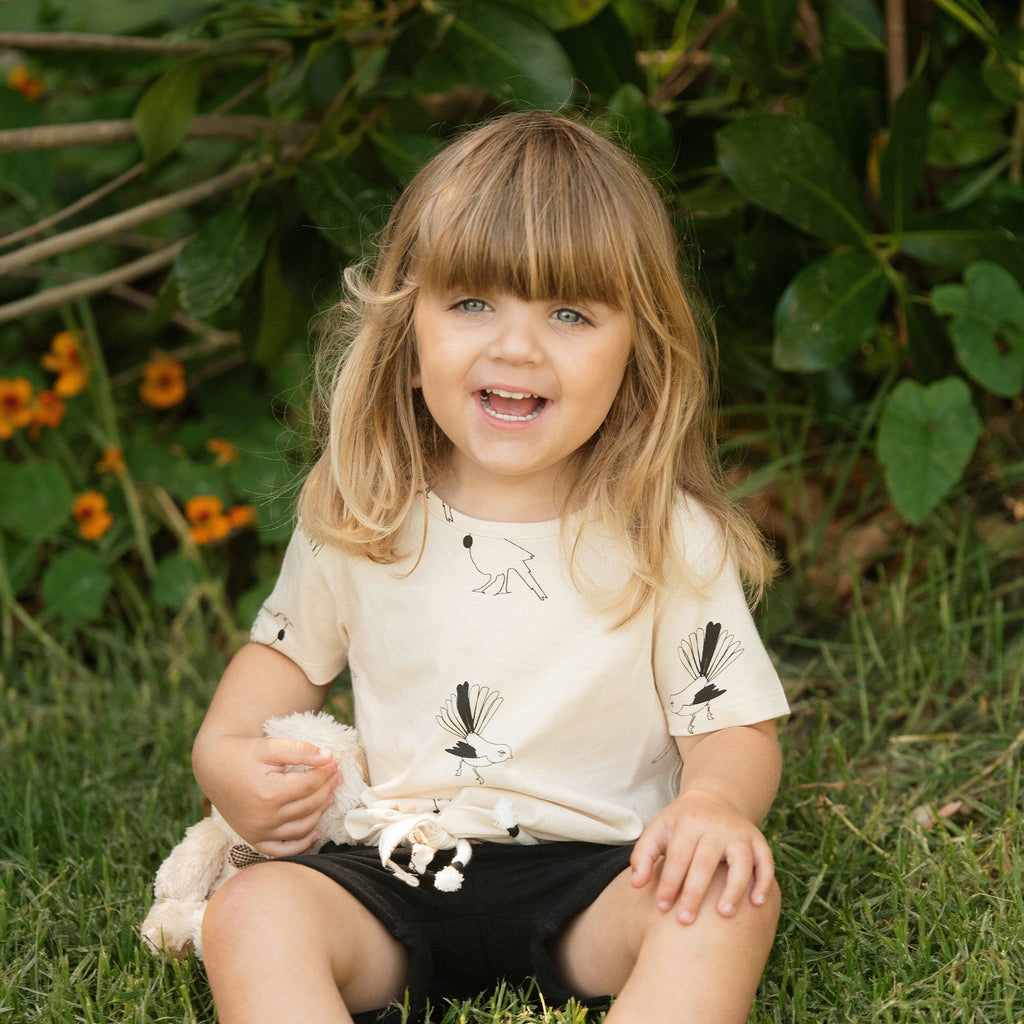 Girl wearing Organic Cotton Tui and Fantail Tee Shirt