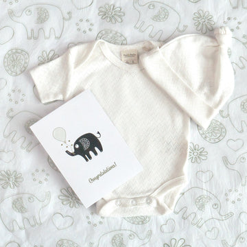 Organic cotton pointelle growsuit, beanie, bodysuit and baby blanket