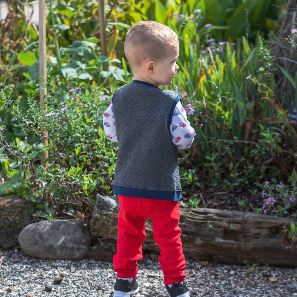 Child wearing organic cotton vans tshirt and red leggings