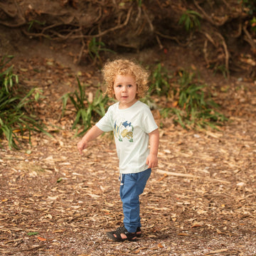 Boy wearing fish tee shirt and Organic Cotton Nautical Blue Fleece Pants